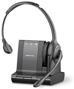 An image of the Plantronics Poly Savi W710 3-in-1 Over-the-Head Mono UC DECT 6.0 Wireless Headset (83545-01) with a single earcup and an attached microphone. The headset is placed on its black charging base, which features a power button, volume control, and other functional buttons, showcasing the headset's versatile connectivity options.