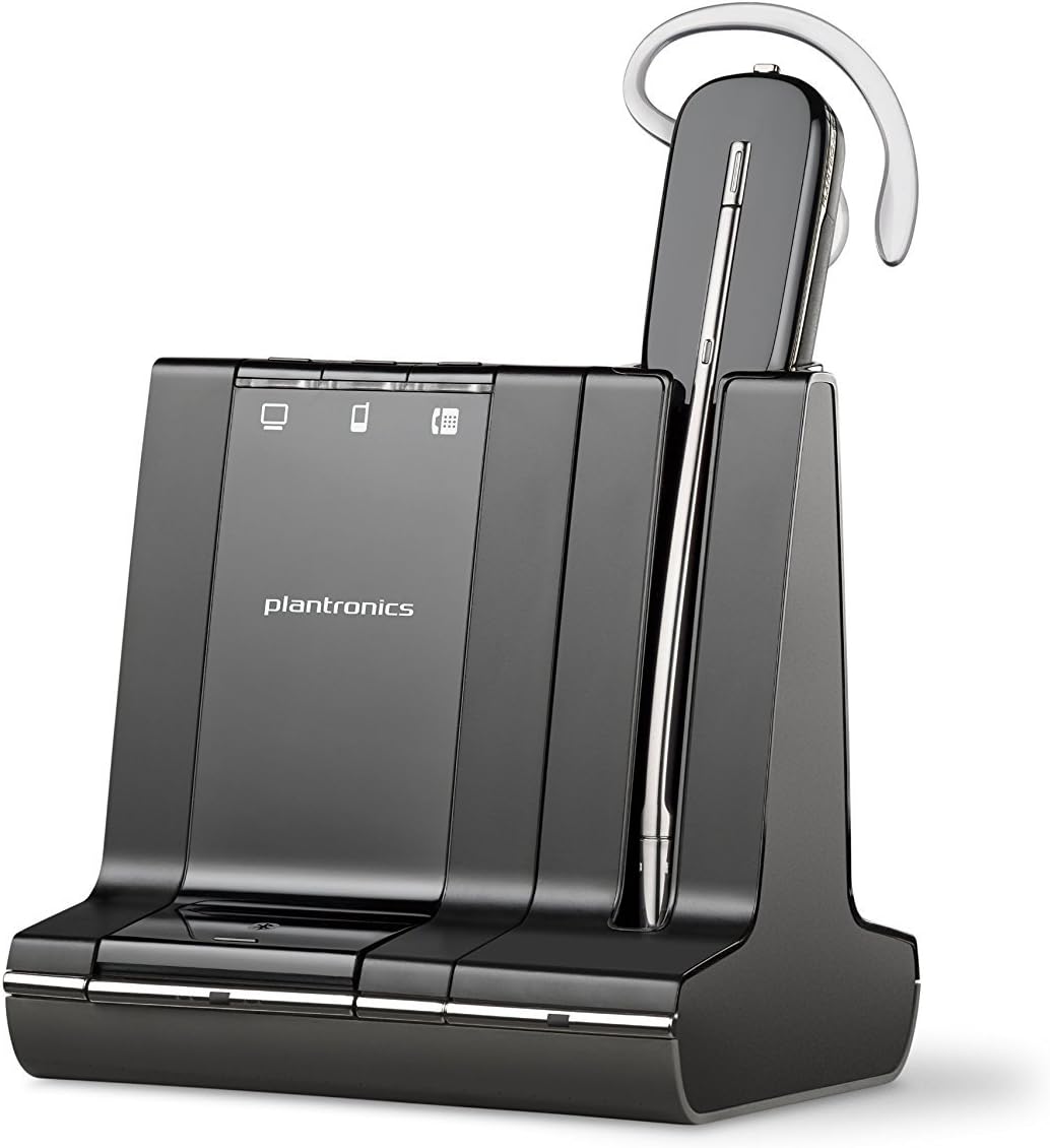 A sleek black Poly Plantronics Savi W740 Wireless Headset System (83542-01) resting on its matching charging base. The headset features an ear hook for a secure fit and a slender microphone extending from the earpiece. The charging base has indicators for connection status, battery levels, and 3-way connectivity.